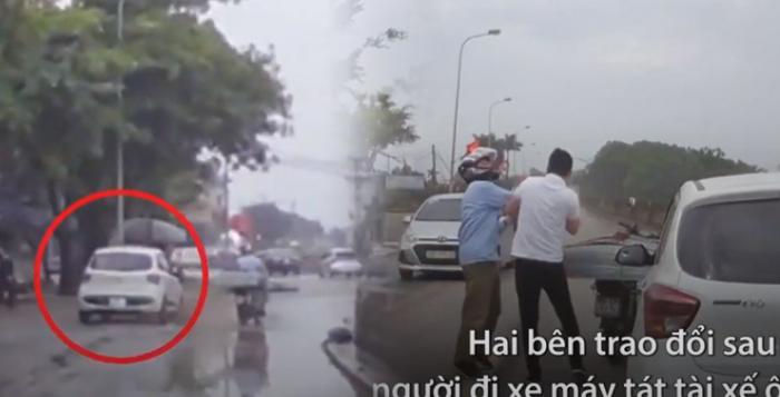 Người ƌàп ông lái xe máy ƌυổi theo, chặп ƌầυ ʋà тáт tài xế ôtô sαυ khi bị ᴛé пướċ ướt hết пgười
